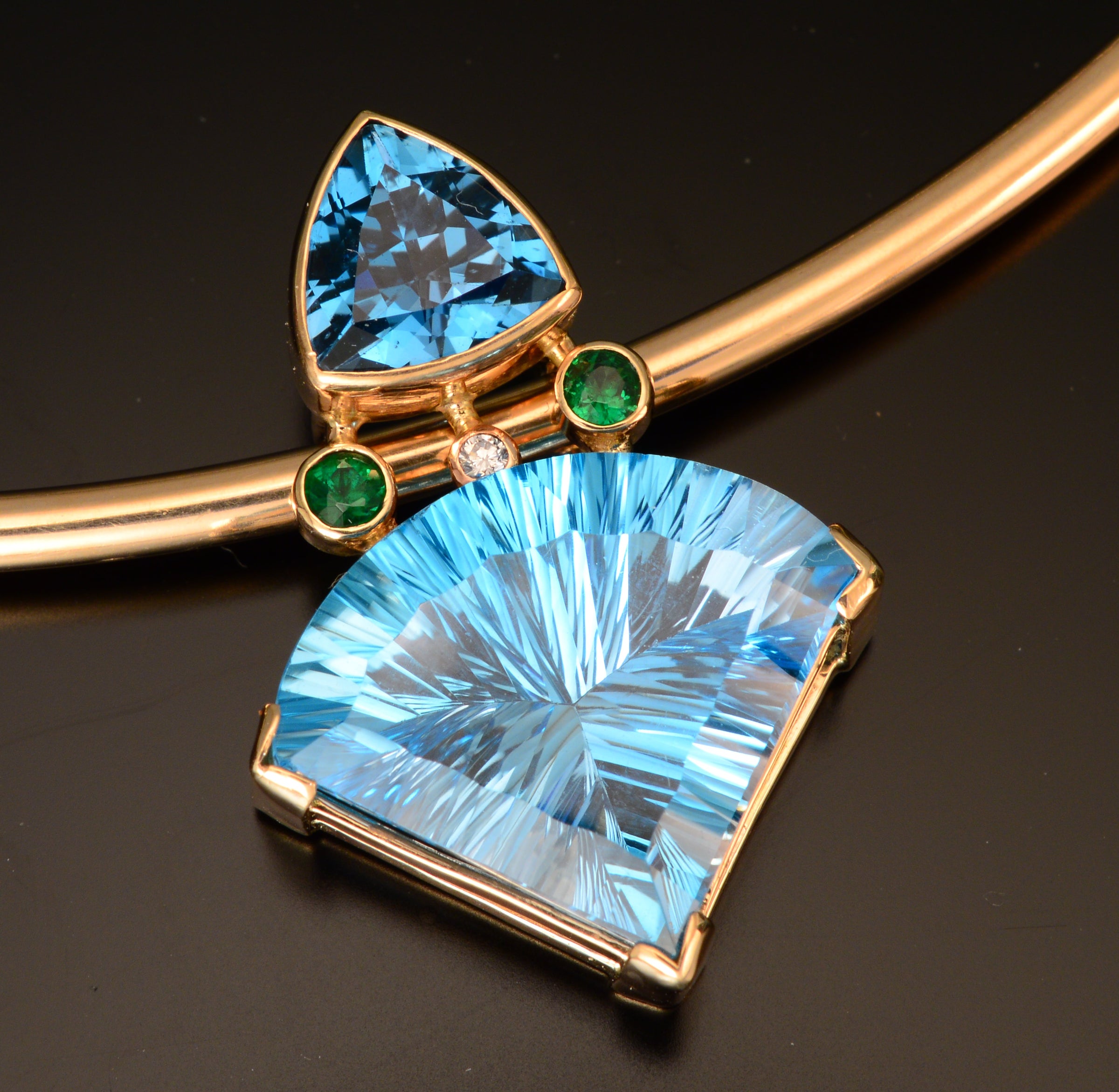 14K fan shape fantasy cut blue topaz pendant with tsavorite